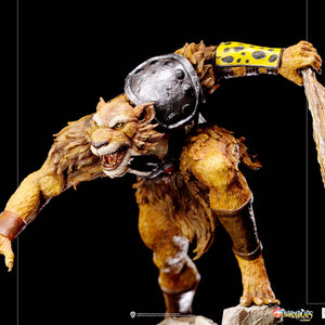 A close-up of the Jackalman statue, highlighting the detailed texture of his wooden club and his fierce expression.