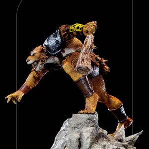 A left profile of the Jackalman statue, emphasizing the motion and gladiator-style shoulder armor on his gladiator shoulder armor.