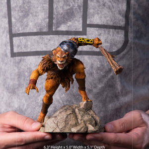 A size comparison photo of the Iron Studios Jackalman statue, showing its height and dimensions with hands on either side for scale.