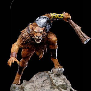 Front view of the Iron Studios Jackalman statue, showing the mutant villain poised on a rocky base with a wooden club.