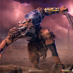 A dynamic action shot of the Jackalman statue from a lower angle, set in a diorama with a stormy pink sky and jagged lightning.