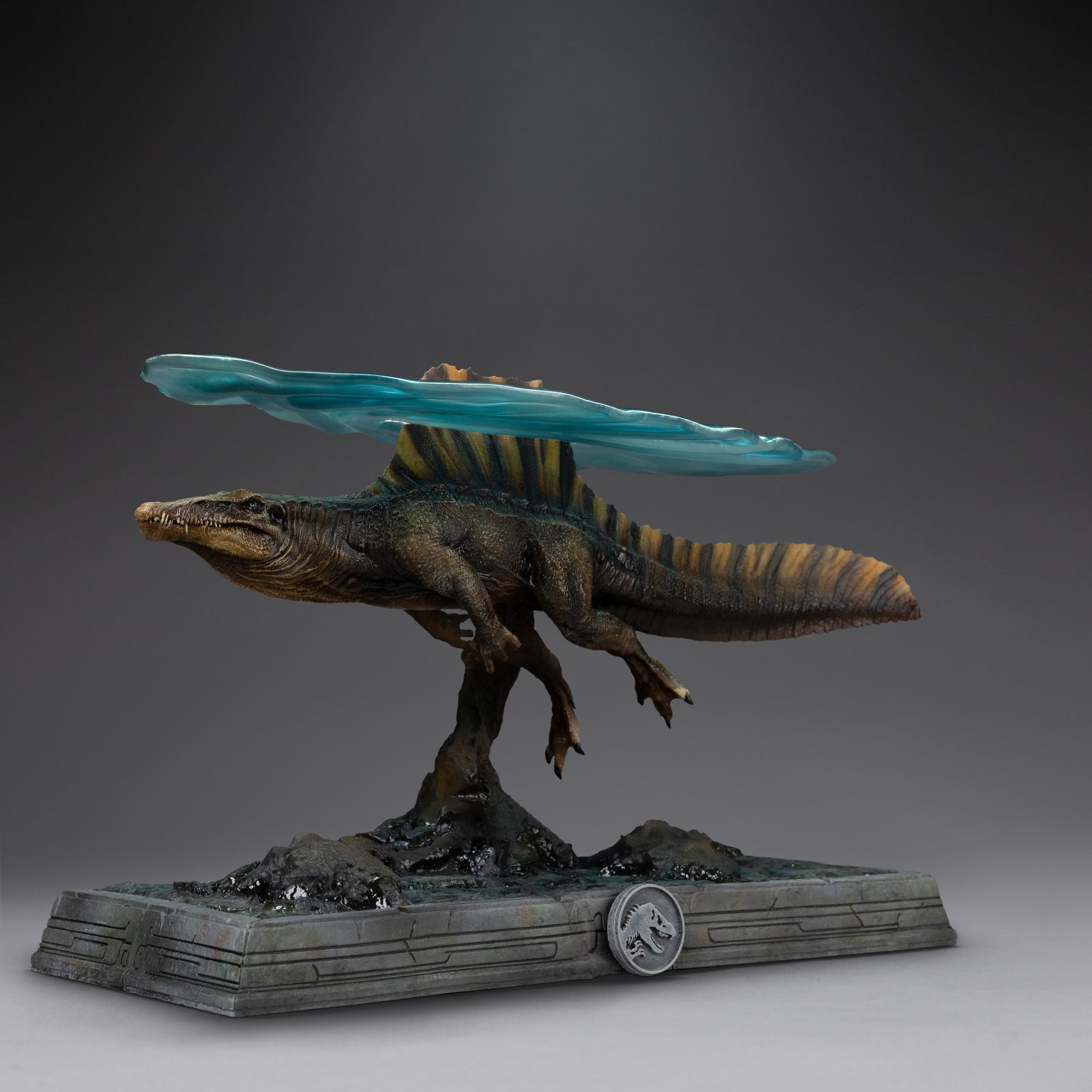 Perspective studio shot of Iron Studios Spinosaurus statue with translucent water surface effect