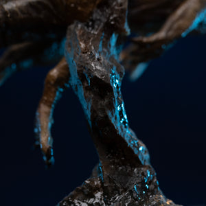 Detail view of Iron Studios Spinosaurus statue rock pillar base mount and splash effects