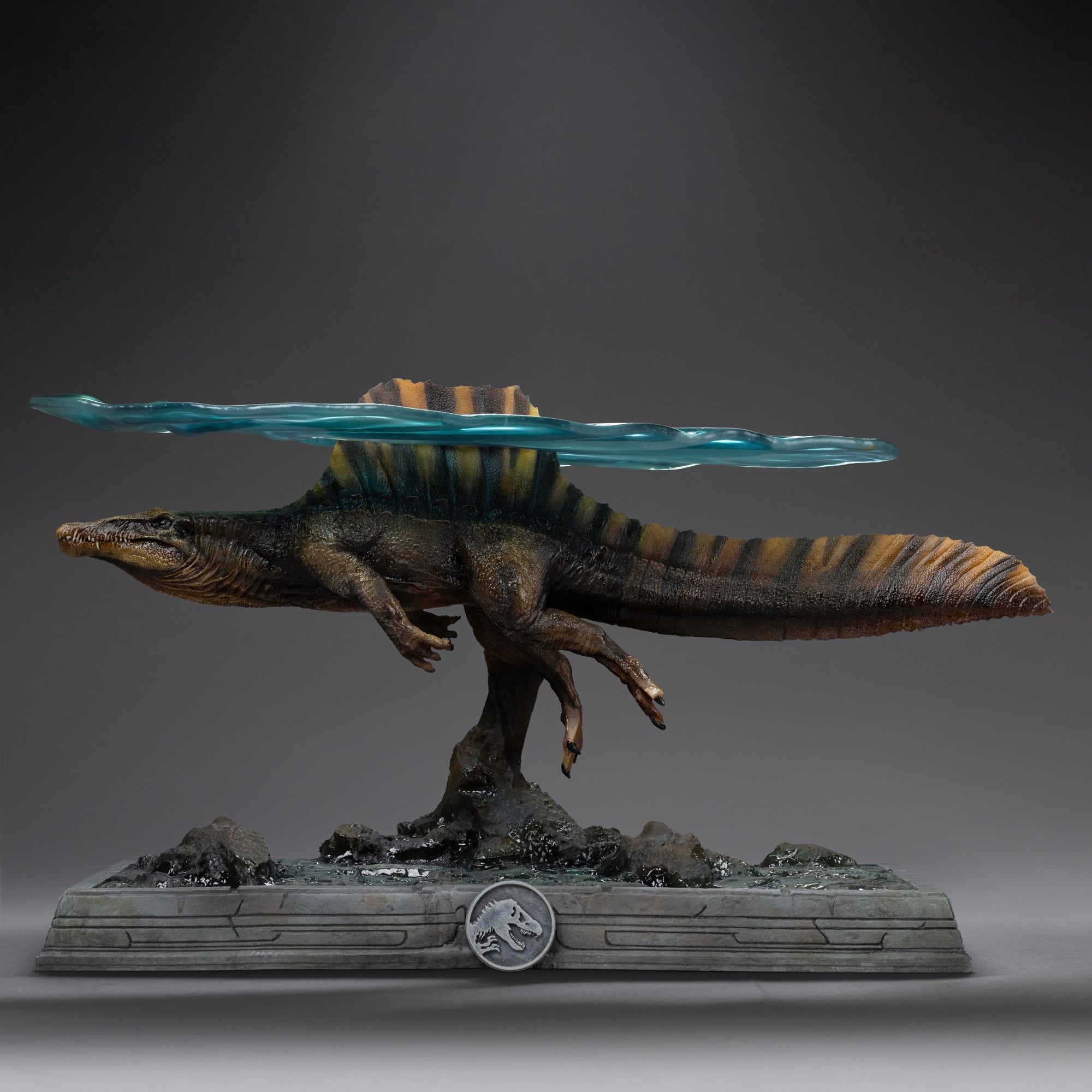 Full side view of Iron Studios Spinosaurus statue with translucent water sheet attached
