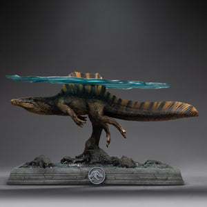 Full side view of Iron Studios Spinosaurus statue with translucent water sheet attached