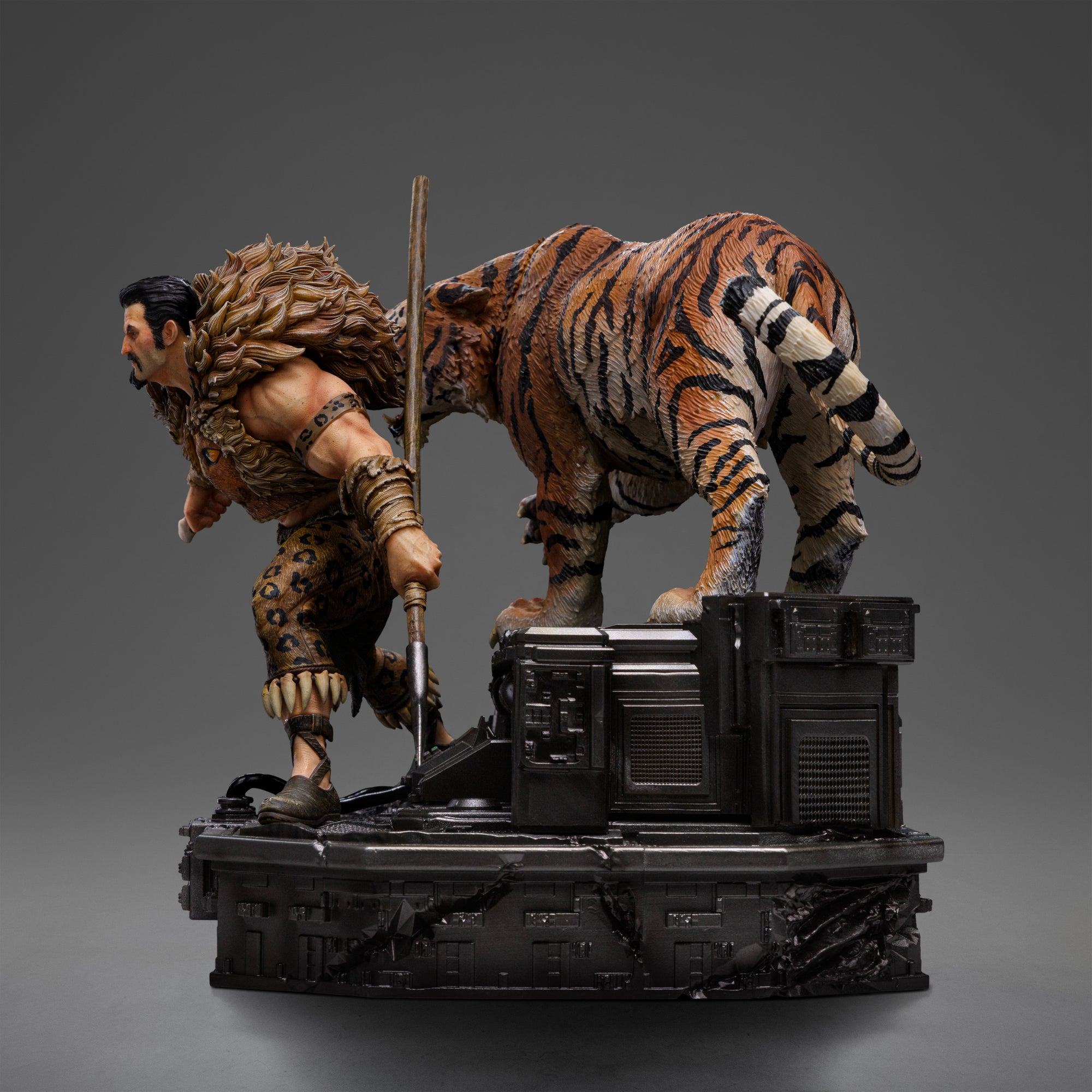 Right side profile of the Kraven the Hunter statue, showing the movement of Kraven and the tiger Dima on the diorama base.
