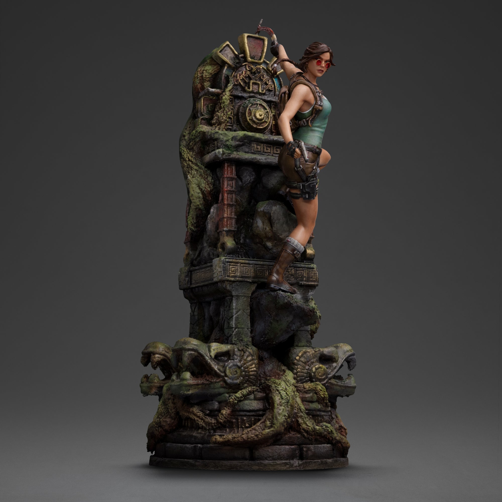 Side view of the Iron Studios Lara Croft statue with sunglasses and pistol, emphasizing the full 14.1-inch height of the ancient ruin diorama base.