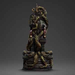 A full rear view of the jungle ruins diorama base on the Lara Croft statue, covered in moss, vines, and intricate stone carvings.