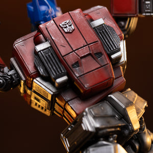 High-angle close-up of the upper back panel and embossed Autobot insignia on the Iron Studios Optimus Prime statue.