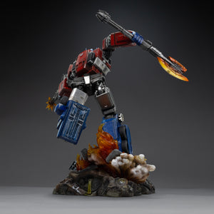 Rear view of the Iron Studios Optimus Prime statue showcasing mechanical armor details and flaming diorama base.