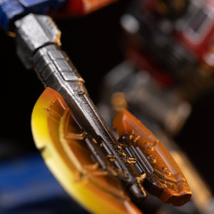 Detailed close-up of the translucent glowing orange and yellow Energon axe weapon wielded by Optimus Prime.