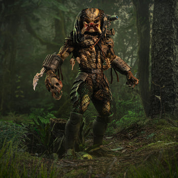 Iron Studios 1/10 Predator Jungle Hunter unmasked statue posed holding skull in a realistic jungle backdrop