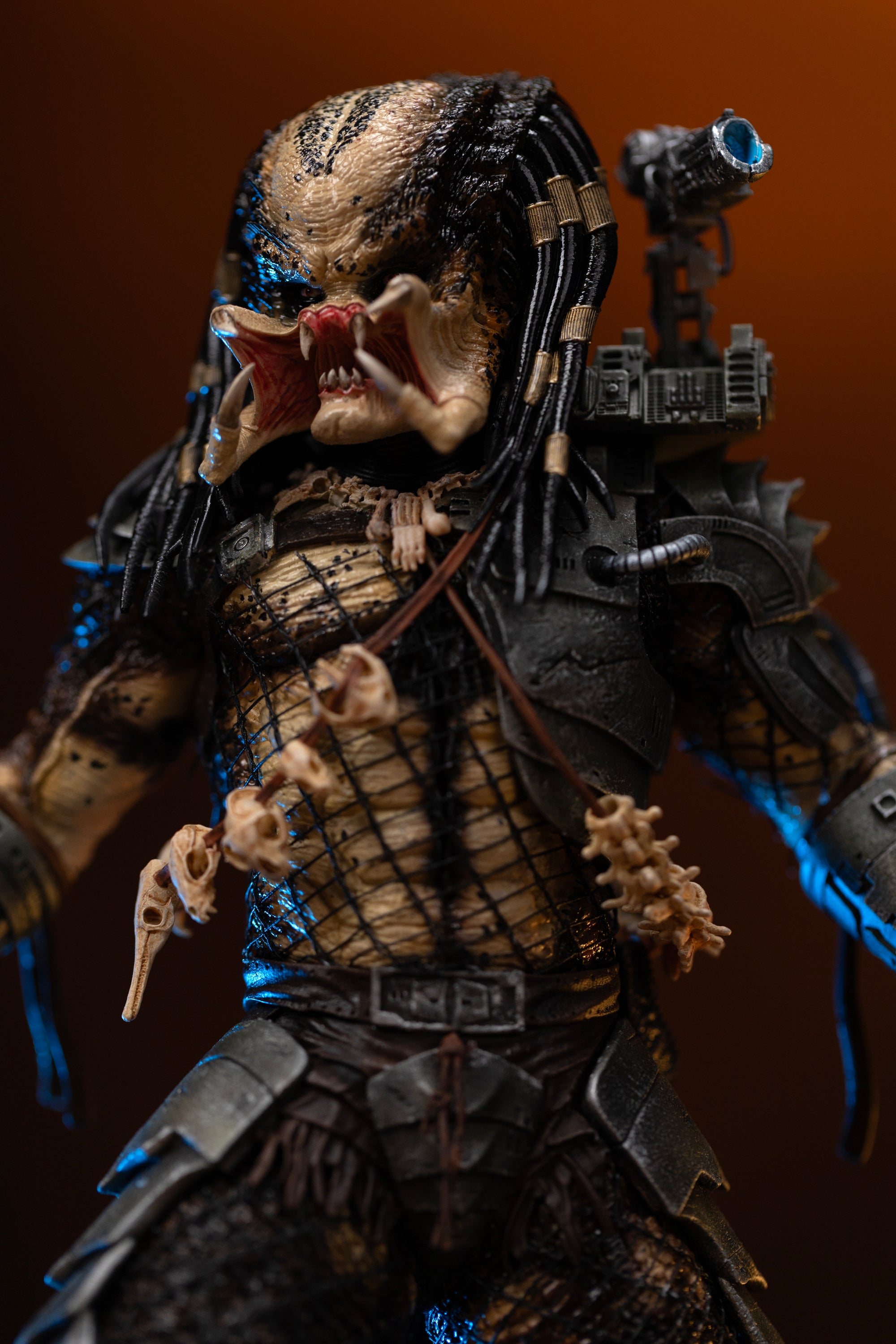 Close-up of Iron Studios Predator Jungle Hunter 1/10 statue unmasked face mandibles and spine trophy necklace
