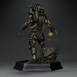Rear perspective of Iron Studios 1/10 Predator Jungle Hunter statue displaying severed skull arm part