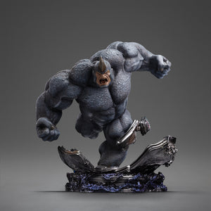 Full frontal view of the Iron Studios Rhino 1/10 Scale Statue, showing the villain mid-charge on a destroyed industrial diorama base.