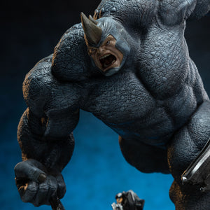 An extreme close-up of Rhino's face, focusing on his open mouth, angry expression, and the small horn protruding from his helmet.