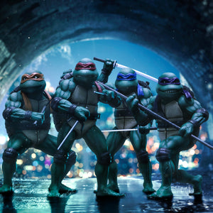 Group lineup composite featuring all four Iron Studios TMNT 1990 Movie 1/10 scale statues: Michelangelo, Raphael, Leonardo, and Donatello.