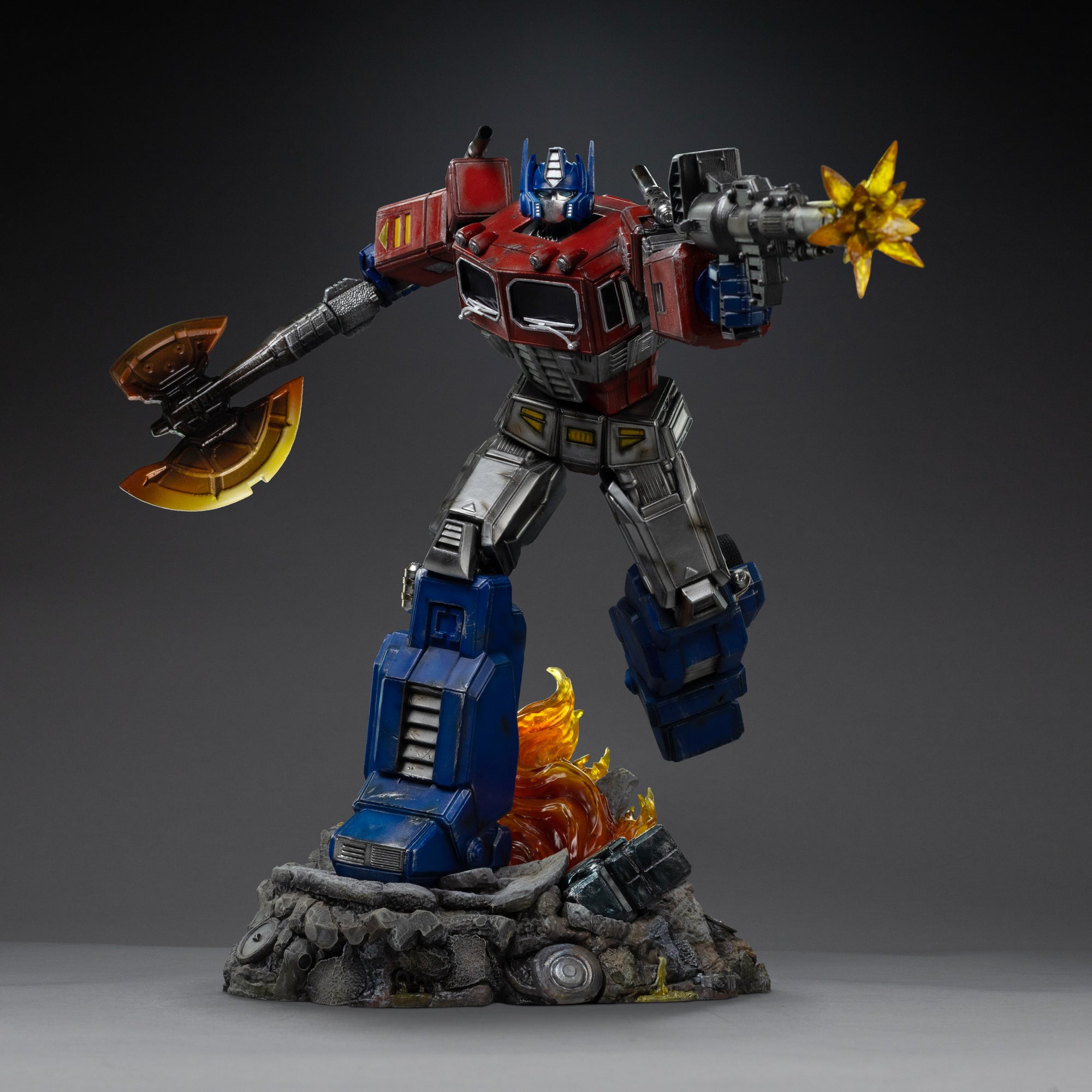 Full front view of the Iron Studios Optimus Prime 1/20 Demi Art Scale statue brandishing an Energon axe and firing an ion blaster.
