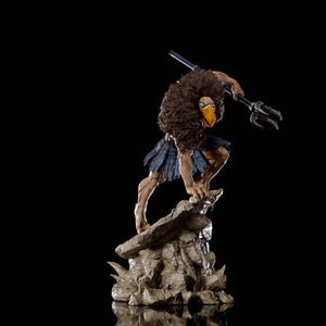 An angled front view of the Vultureman statue, showing the character gripping his staff and preparing to strike.