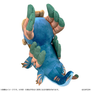 Rear view of the Jin Dahaad chibi plush showing the green dorsal fins, striped tail, and soft textured details of the 7.87-inch long collectible.