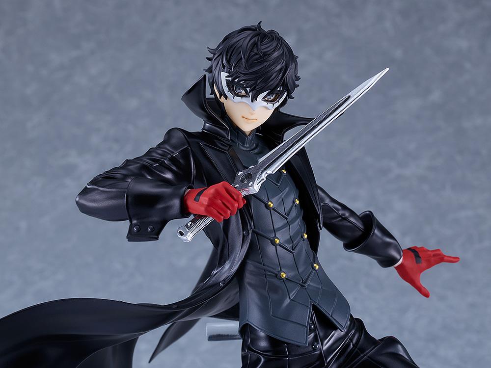 Detailed mid-shot of the Joker figure focusing on the intricate paintwork of his mask, eyes, and silver dagger.