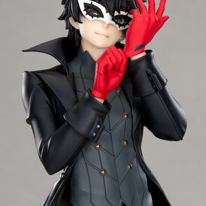 Close-up portrait view of the Joker scale figure focusing on his detailed white bird mask, confident smirk, messy black hair, and bright red gloves.