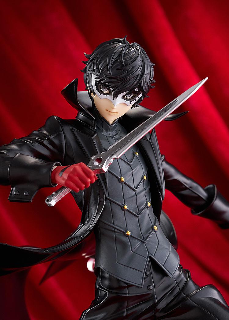 Close-up cinematic shot of the Joker figure wearing his mask and red gloves, posed against a dramatic red draped background.