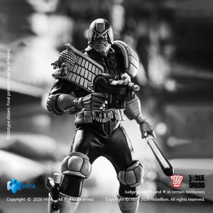 Close action view of the Hiya Toys Exquisite Super Judge Dredd figure in black and white aiming the Lawgiver machine pistol with grimacing expression.