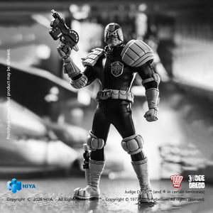 Full-length atmospheric shot of the black and white Judge Dredd figure standing with raised Lawgiver pistol on a reflective street surface.