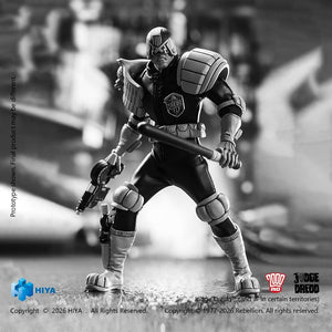 Dynamic combat stance of the monochrome Judge Dredd action figure brandishing the Daystick baton and Lawgiver in a riot suppression pose.