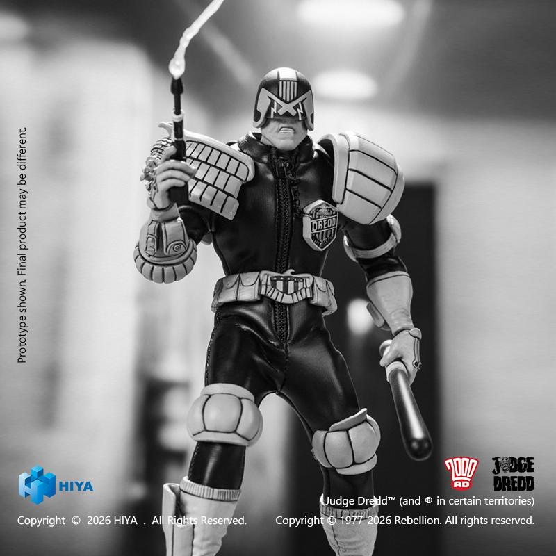 Monochrome Judge Dredd figure using the Boing! aerosol spray can with attached foam effect part while gripping the Daystick baton.