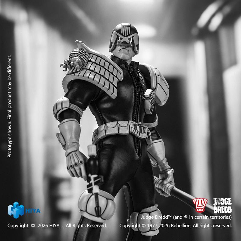Three-quarter shot of the black and white Judge Dredd action figure on patrol holding a Daystick baton in a gritty Mega-City One setting.