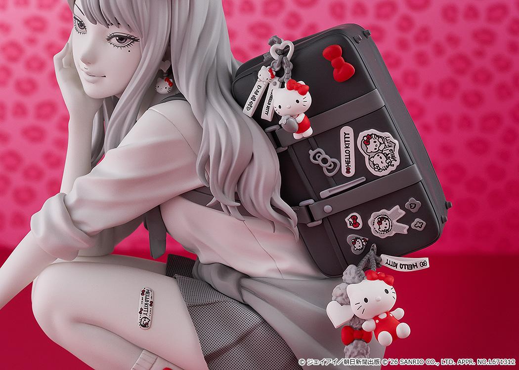 Macro close-up of the intricately detailed school bag with Hello Kitty stickers, plush charms, and the Hello Kitty tattoo sticker on Tomie's leg.