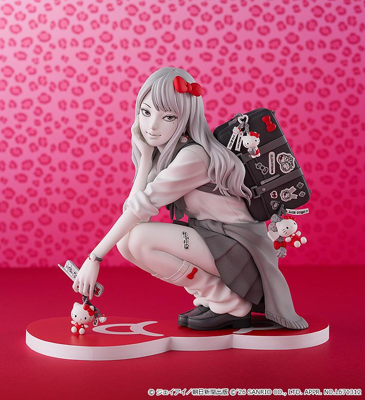 Full-body promotional display of the Gyaru Tomie x Hello Kitty figure posed against a vibrant pink leopard-print background.