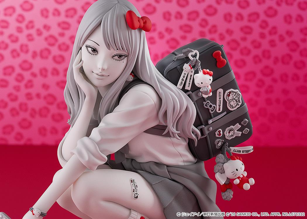 Upper body close-up of the Gyaru Tomie figure highlighting her sly facial expression, Hello Kitty charms, and school uniform details.