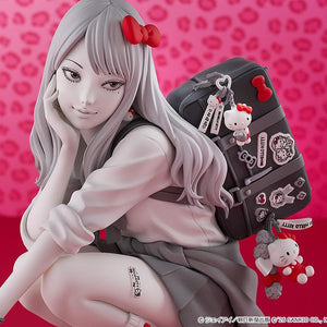 Upper body close-up of the Gyaru Tomie figure highlighting her sly facial expression, Hello Kitty charms, and school uniform details.