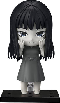 Front view of Nendoroid Tomie from Junji Ito Maniac in monochrome grayscale with smiling face plate.