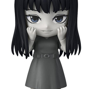 Front view of Nendoroid Tomie from Junji Ito Maniac in monochrome grayscale with smiling face plate.