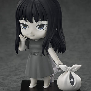 Tomie Nendoroid figure waving and holding the creepy plastic bag accessory with a hidden eye.