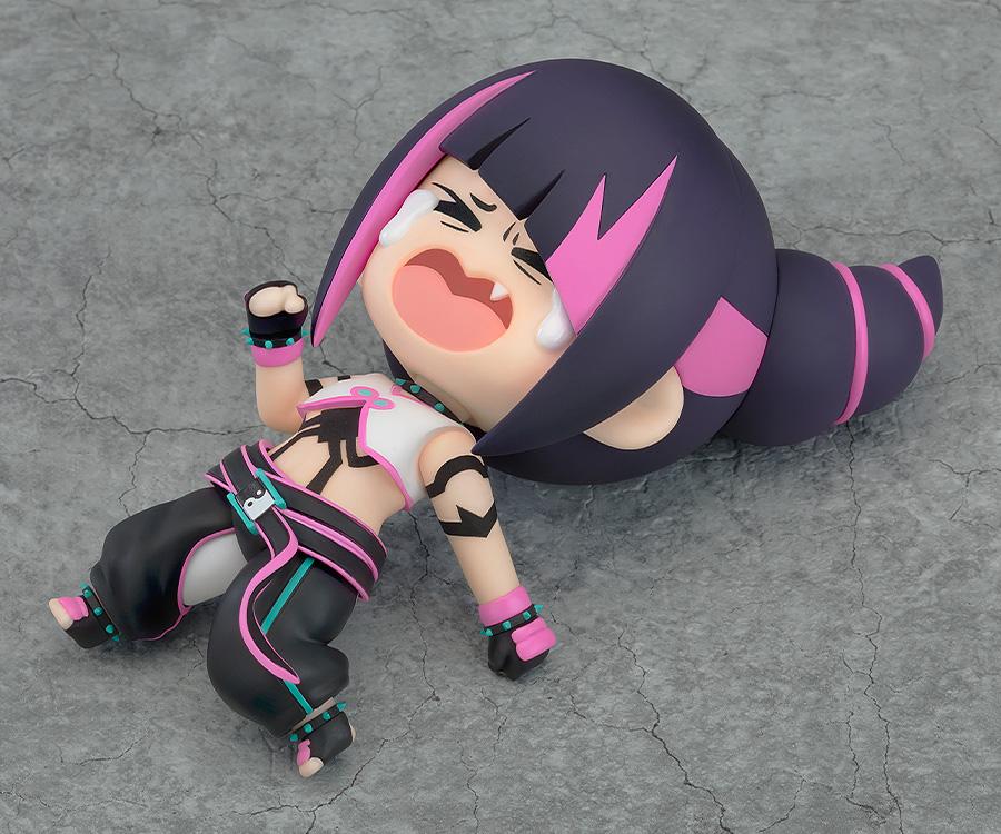Juri-chan Nendoroid displayed with a crying face plate while lying flat on her back.