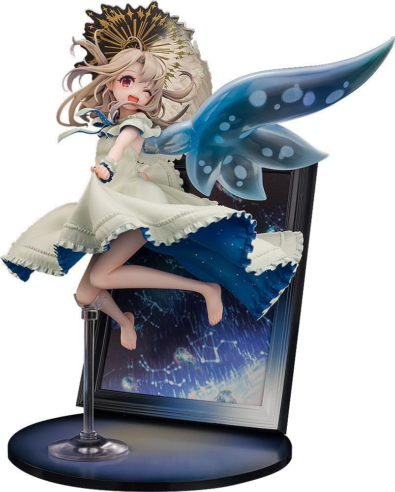 Full frontal view of the KADOKAWA Illyasviel Von Einzbern 15th Anniversary 1/7 Scale Figure, winking and jumping out of a photo frame base with clear wings.