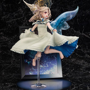 Three-quarter view of the Illyasviel figure, showing her playfully pulling up her dress skirt over the dark, cosmic photo frame base.