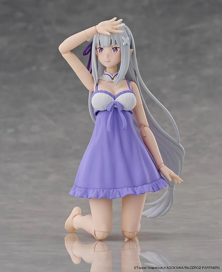The Emilia figure in her swimsuit, posed kneeling down with a relaxed expression, demonstrating flexibility.