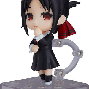 Full-body profile view of the Kaguya Shinomiya Nendoroid figure from Kaguya-sama: Love is War, wearing her black Shuchiin Academy school uniform and holding a hand to her chin on a white background.