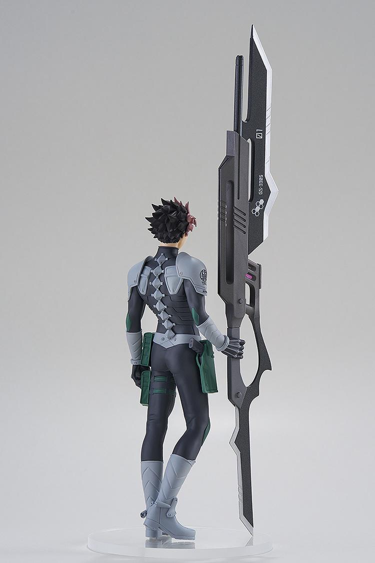 Rear view of the Gen Narumi figure highlighting the spinal armor design of the Defense Force suit and the back of the large weapon.