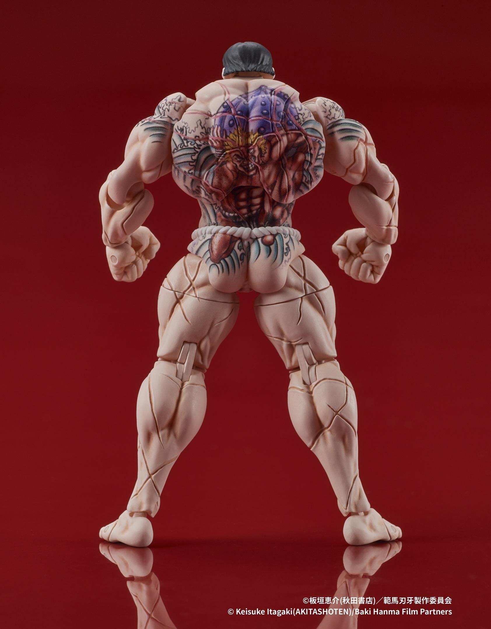 Back view of the Kaoru Hanayama figure showcasing the iconic Standing Man tattoo.