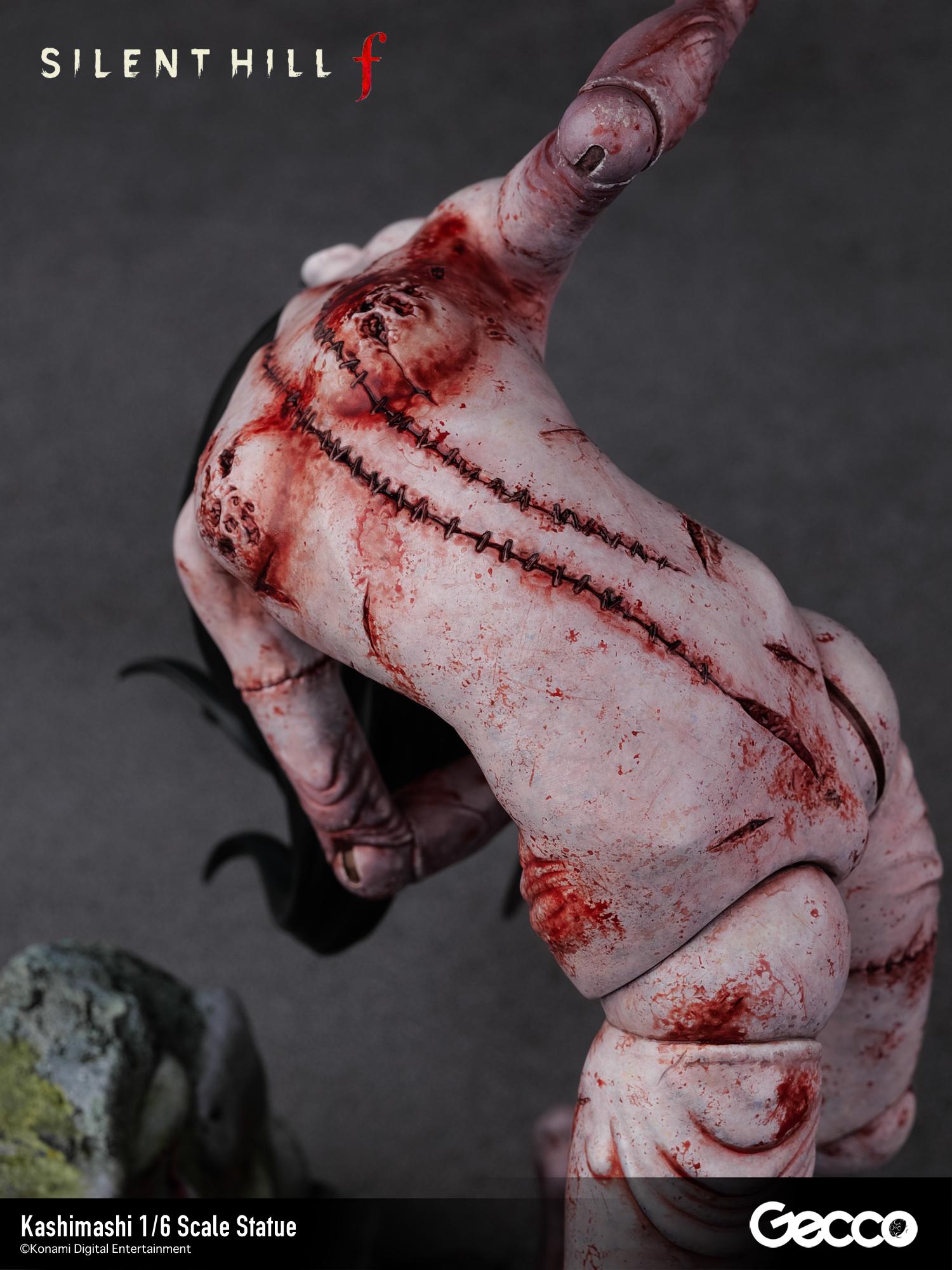 Close-up of the back of the Kashimashi creature, emphasizing the heavy stitching and graphic, grotesque paintwork.