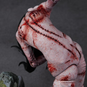 Close-up of the back of the Kashimashi creature, emphasizing the heavy stitching and graphic, grotesque paintwork.