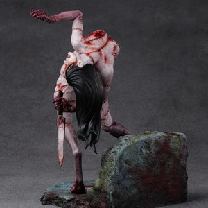 Rear angled view of the Kashimashi statue focusing on the intricate sculpting of the back muscles and gruesome surgical-style stitching.