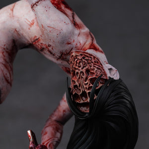 Top-down view of the Kashimashi statue with the sliced face part, highlighting the realistic hair and the horrific facial cavity.